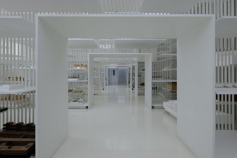 Bright white room lined with shelving