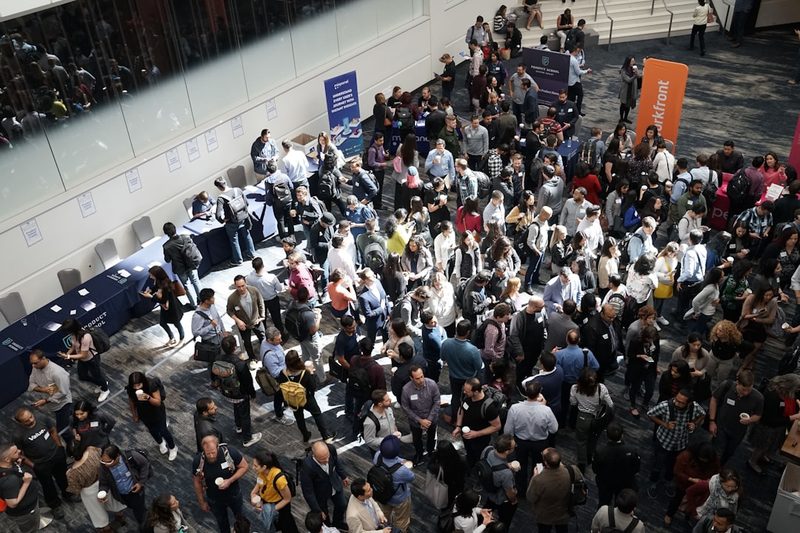Attendees gathering in a conference hall